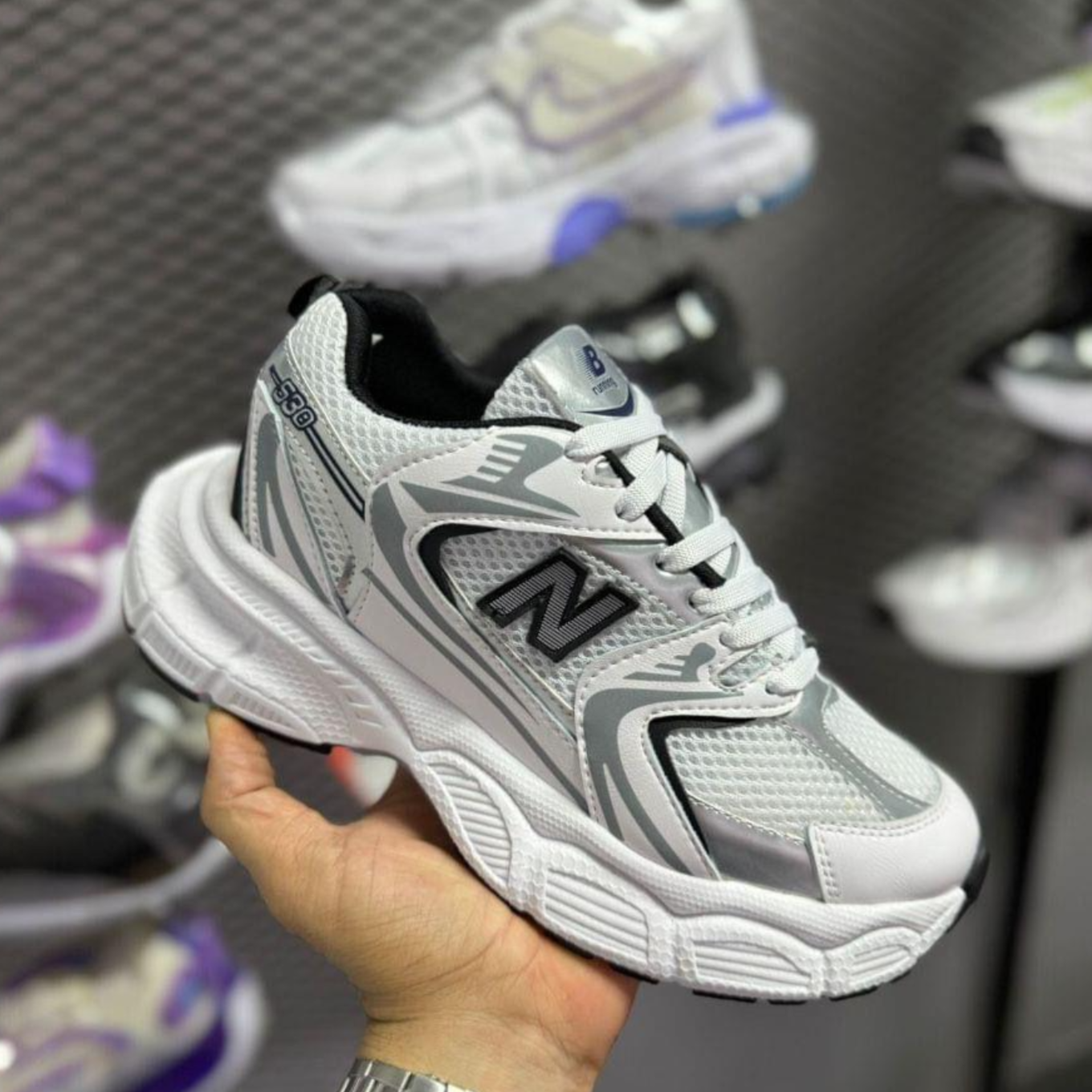 New Balance Sport.